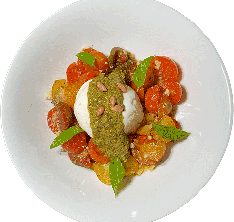 Burrata con jitomates cherry, pesto de avellanas y piñones